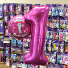 large and small Pink Happy 1st Birthday Balloons
